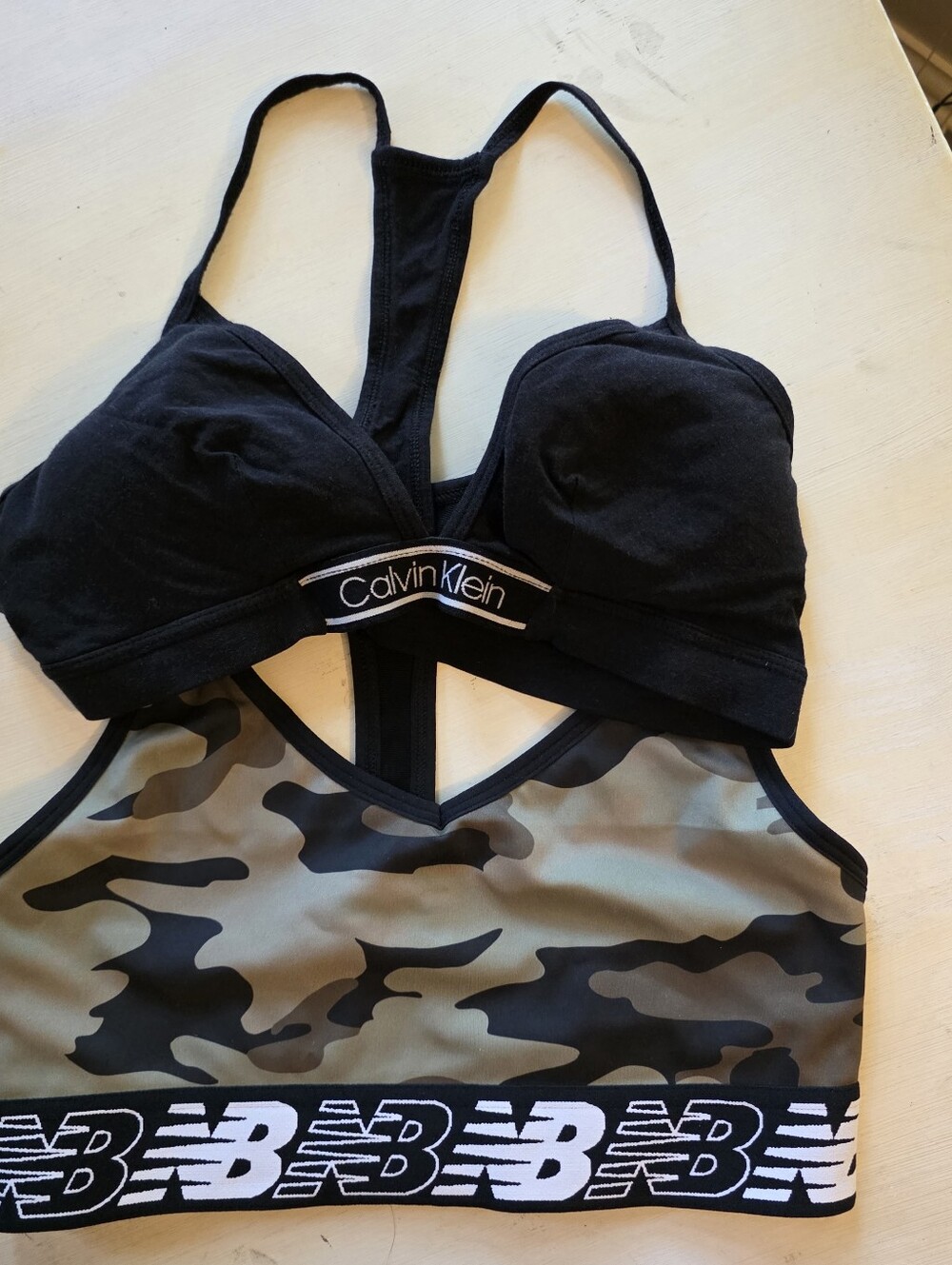 Two bras Calvin Klein New Balance Black & Olive Camo Sports Bra